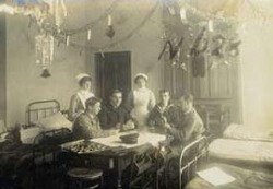 Nurses playing cards with soldiers